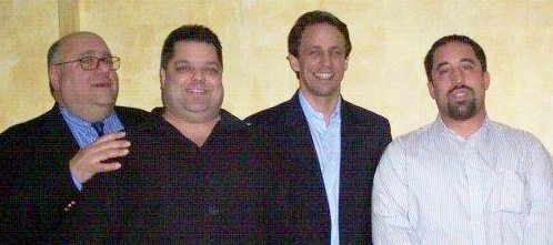 Paul Dreifuss in a picture with 3 men, including  Seth Meyers